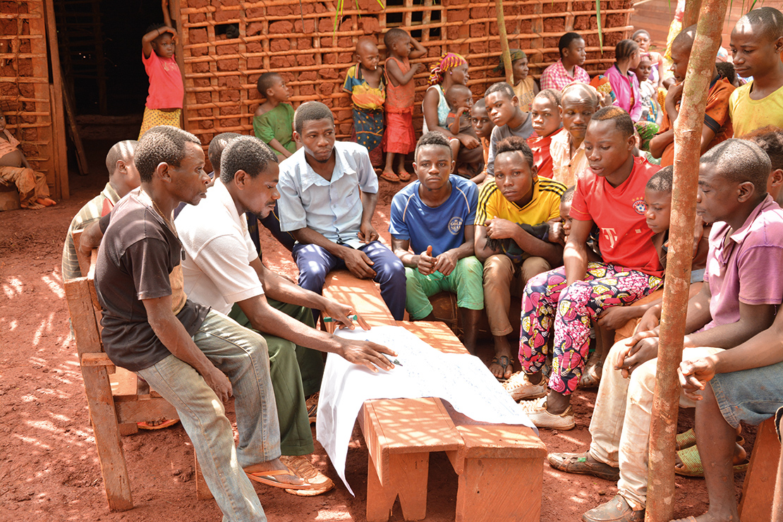 Participating in a community planning meeting in Dioula, Mambele, Cameroon. Credit: Viola Belohrad.