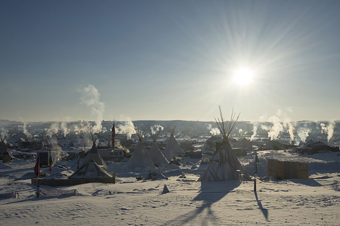 Early morning at Oceti Sakowin Camp, one of the protest camps formed to block the development of the Dakota Access Pipeine in the USA. Credit: Photo Image.